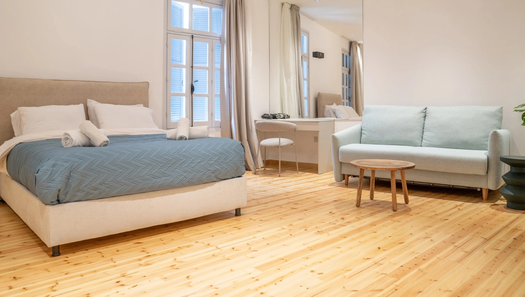 spacious room in Larnaca near Finikoudes Beach with double bed and sofa bed